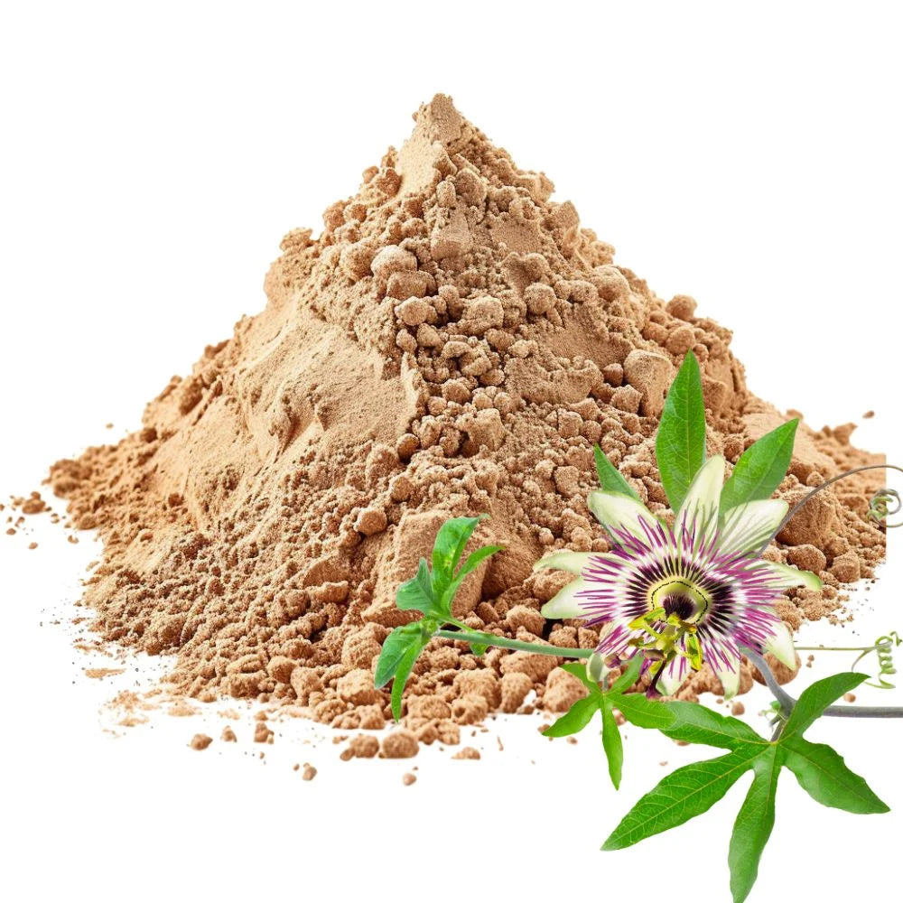 Heaped pile of Passion Flower herb powder with a vibrant Passion Flower and green leaves on a white background - WowNutri
